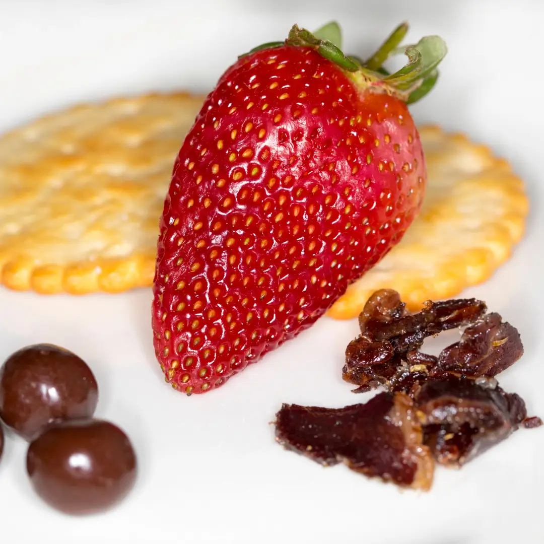 strawberry, crackers and chocolates with biltong indicating biltong platter 2024 trends